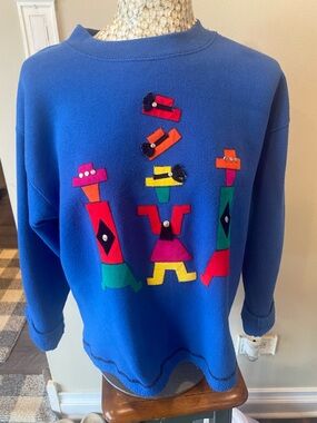 Blue Crewneck Sweater with Colorful Geometric Appliqué
